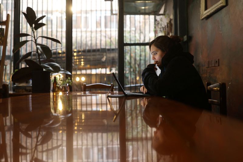 An Iranian woman, Samaneh, tries to connect to the internet to check on her visa status for her migration process, after a nationwide internet shutdown since January 8, 2026, following Iran's protests, in Tehran, Iran, January 25, 2026. Majid Asgaripour/WANA (West Asia News Agency) via REUTERS/File Photo