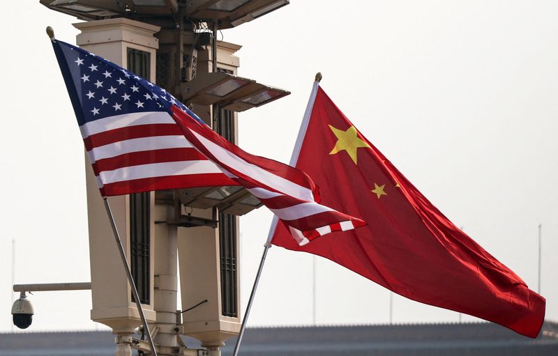 U.S. and China’s national flags flutter in Tiananmen Square, ahead of U.S. President Donald Trump's visit to China, in Beijing, China, May 13, 2026. REUTERS/Maxim Shemetov