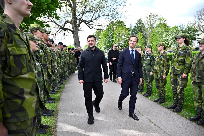 Swedish Prime Minister Ulf Kristersson walks with Ukrainian President Volodymyr Zelenskiy at the F16 air flotilla in Uppsala, Sweden, May 28, 2026. Christine Olsson/TT News Agency/via REUTERS