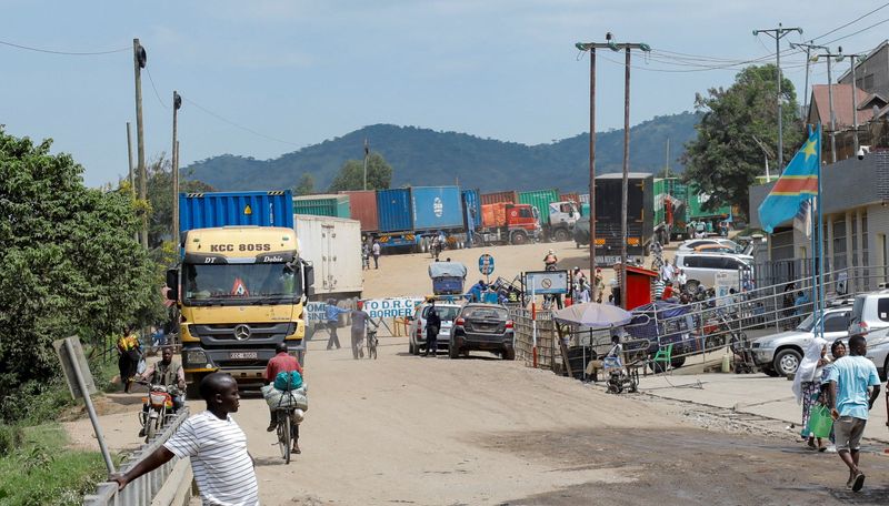 People walk , after Uganda closed its borders with the Democratic Republic of Congo, as authorities intensify efforts to contain a new Ebola outbreak caused by the Bundibugyo virus strain, at the Mpondwe border post, in Kasese district, Uganda, May 28, 2026. REUTERS/Abubaker Lubowa