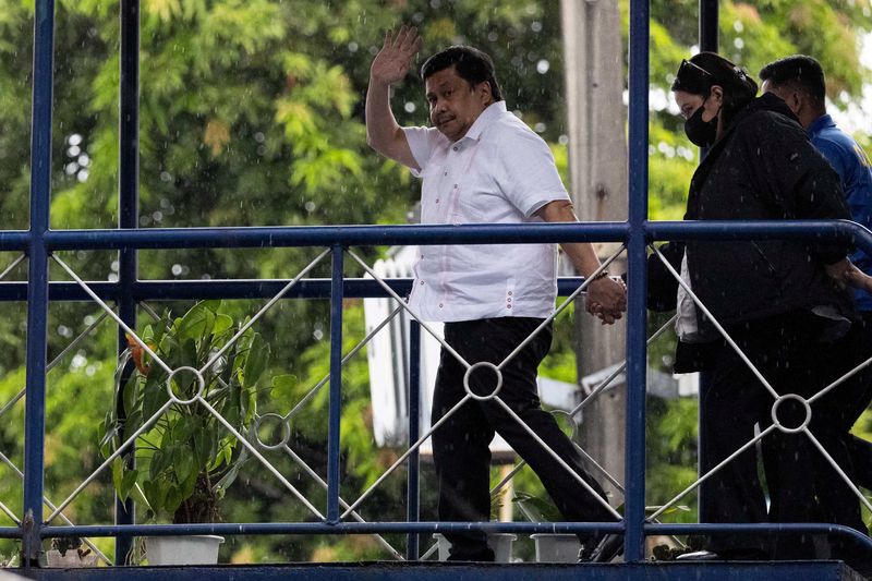 Philippine Senator Jose "Jinggoy" ⁠Estrada waves at the Philippine National Police headquarters after surrendering to the police over a graft case, in Quezon City, Philippines, June 1, 2026. REUTERS/Eloisa Lopez