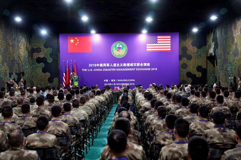 FILE PHOTO: U.S. Army and China's People's Liberation Army (PLA) military personnel attend a closing ceremony of an exercise of "Disaster Management Exchange" near Nanjing, Jiangsu province, China November 17, 2018. REUTERS/Aly Song/File Photo