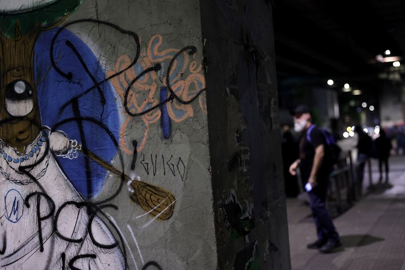 People walk past graffiti reading "PCC", referring to Brazilian drug gang Primeiro Comando da Capital, after U.S. Secretary of State Marco Rubio announced a policy to designate "PCC" and Comando Vermelho "CV" as foreign "terrorist organizations", in Sao Paulo, Brazil, May 31, 2026. REUTERS/Amanda Perobelli