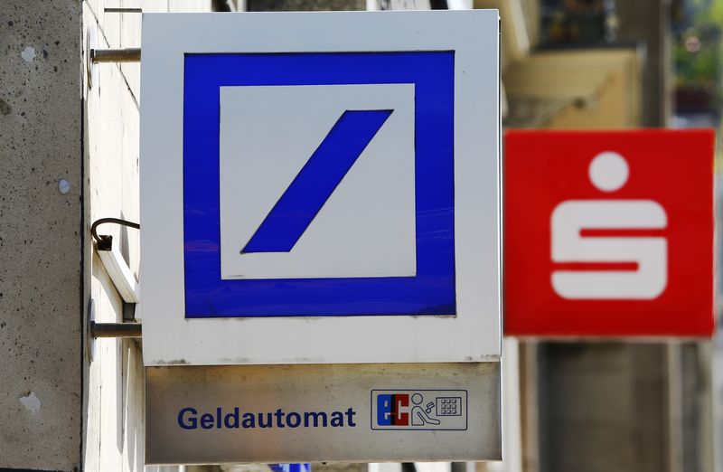 Logos of Germany's Deutsche Bank and Sparkasse (R) are seen in Cologne, Germany, July 18, 2016.  REUTERS/Wolfgang Rattay