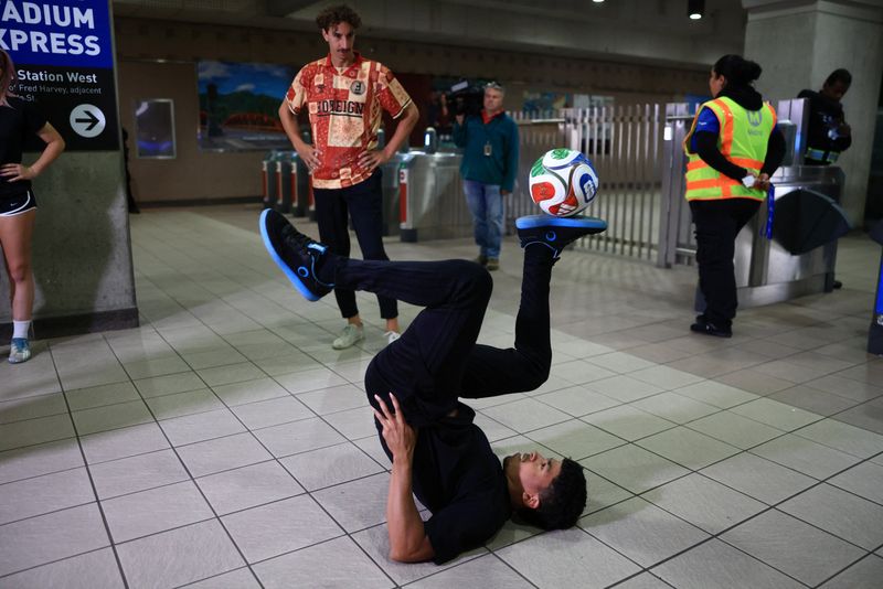Freestyle soccer performer Umar Daliti entertains travelers as LA Metro launches contactless credit and debit card fare payment and the LA Metro mobile app ahead of the FIFA World Cup, at Union Station in Los Angeles, California, U.S., May 28, 2026. REUTERS/David Swanson