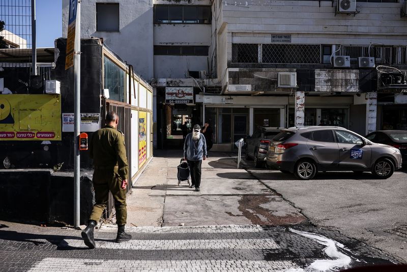 An Israeli soldier crosses a road in Kiryat Shmona, northern Israel, June 2, 2026. REUTERS/Shir Torem