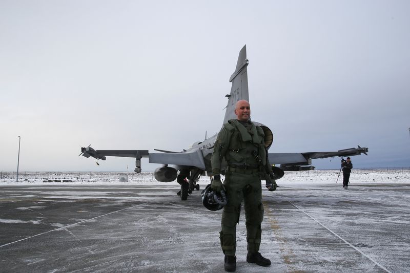 Squadron commander and pilot in the Swedish Air Force, Lieutenant Colonel Robin Arvidsson, stands for a photograph in front of a JAS 39 Gripen, in Keflavik, Iceland, March 3, 2026. REUTERS/Tom Little