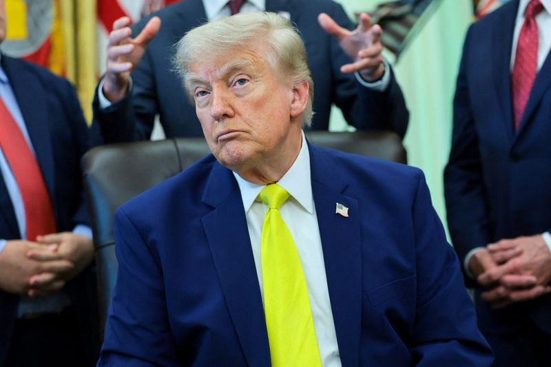 U.S. Secretary of Energy Chris Wright gestures as he delivers remarks to reporters about the Trump administration's support for coal energy production, standing behind U.S. President Donald Trump, in the Oval Office at the White House in Washington, D.C., U.S., June 4, 2026. REUTERS/Jonathan Ernst