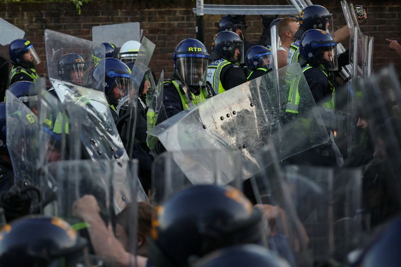 Protesters clash with police officers during a demonstration following the conviction of Vikrum Digwa for the murder of student Henry Nowak, in Southampton, Britain, June 2, 2026. REUTERS/Isabel Infantes