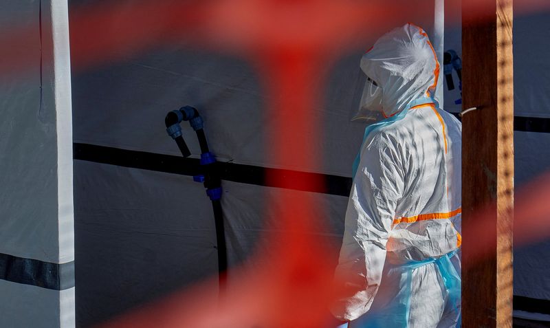 A health worker is dressed up in personal protective equipment (PPE) at the Evangelical Medical Center, one of the facilities at the forefront of the response to the Ebola outbreak, as agencies intensify efforts to contain a new Ebola outbreak caused by the Bundibugyo virus strain, in Bunia, Ituri province, Democratic Republic of Congo, May 31, 2026. REUTERS/Gradel Muyisa Mumbere