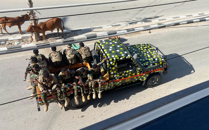 A truck carrying Somali security forces drives on a road ahead of a planned protest against Somalia's President Hassan Sheikh Mohamud over his decision to remain in office after his term expired last month, in Mogadishu, Somalia, June 4, 2026. Picture taken with a mobile phone. REUTERS/Feisal Omar