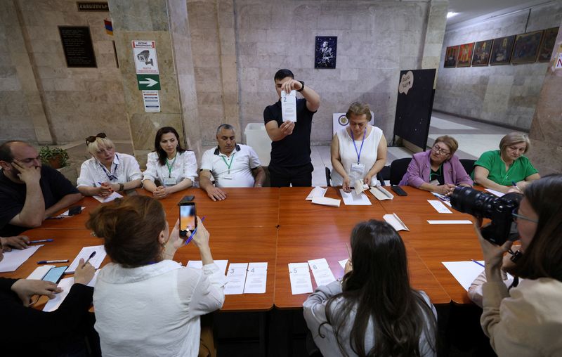 Members of an electoral commission count votes after polling stations closed in a parliamentary election in Yerevan, Armenia, June 7, 2026. Vahram Baghdasaryan/Photolure via REUTERS