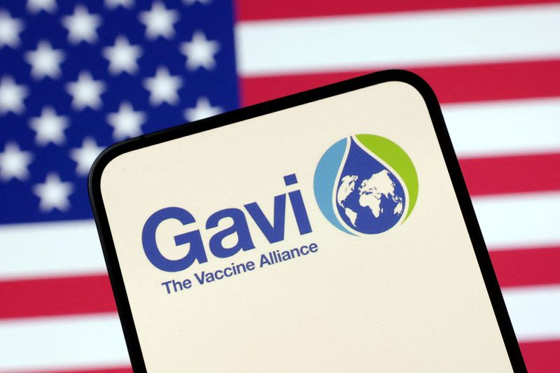 FILE PHOTO: The Vaccine Alliance (GAVI) logo and U.S. flag are seen in this illustration taken April 23, 2025. REUTERS/Dado Ruvic/Illustration/File Photo