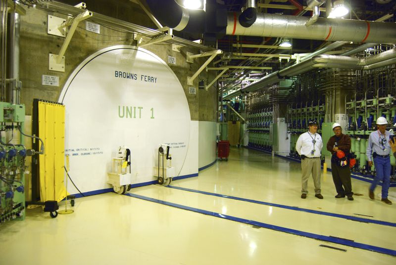 Nuclear officials stand near the entrance to a reactor at the Browns Ferry nuclear facility in Alabama, in this photo taken March 25, 2011. REUTERS/Matthew Bigg