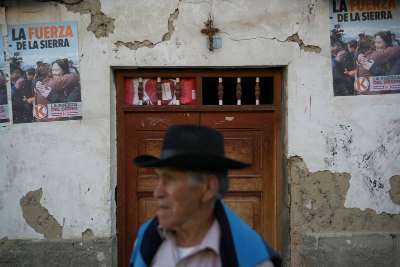 A person stands near signs showing conservative presidential candidate Keiko Fujimori in the town where voters backed Fujimori and leftist candidate Roberto Sanchez in the June 7 election in a rare close tie that mirrors a razor-thin national race, in Lahuaytambo, Peru, June 12, 2026. REUTERS/Alessandro Cinque     TPX IMAGES OF THE DAY