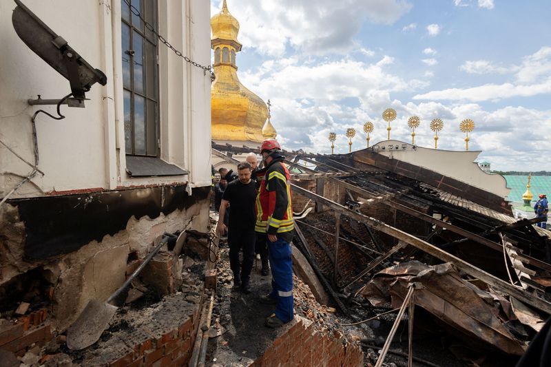 Ukraine's President Volodymyr Zelenskiy visits the Dormition Cathedral of the Kyiv Pechersk Lavra, which was hit during Russian missile and drone strikes, amid Russia's attack on Ukraine, in Kyiv, Ukraine June 15, 2026. Ukrainian Presidential Press Service/Handout via REUTERS