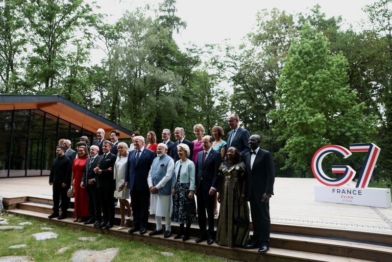 Italy's Prime Minister Giorgia Meloni, European Council President Antonio Costa, Ukraine's President Volodymyr Zelenskiy, Caroline Merotto, wife of Switzerland's President Guy Parmelin, Japan's Prime minister Sanae Takaichi, Swiss Federal President Guy Parmelin, Brazil's Rosangela "Janja" da Silva, Brazil's President Luiz Inacio Lula da Silva, South Korea's President Lee Jae-myung, France's President Emmanuel Macron, South Korea's first lady Kim Hea Kyung, French President's wife Brigitte Macron, British Prime Minister's wife Victoria Starmer, U.S. President Donald Trump, Britain's Prime Minister Keir Starmer, India's Prime Minister Narendra Modi, Canada's Prime Minister Mark Carney, Canadian Prime Minister's wife Diana Carney, European Commission President Ursula von der Leyen, German Chancellor's wife Charlotte Merz, European Commission President's husband Heiko von der Leyen, , Germany's Chancellor Friedrich Merz, Kenya's first lady Rachel Ruto and Kenya's President William Ruto pose for a family photo before a cultural performance and concert during the G7 summit, in Evian-les-Bains, France, June 16, 2026. REUTERS/Evelyn Hockstein