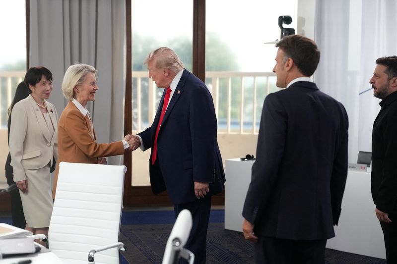 Japan’s Prime Minister Sanae Takaichi, European Commission President Ursula von der Leyen, U.S. President Donald Trump, French President Emmanuel Macron and Ukrainian President Volodymyr Zelenskiy during a working session at the G7 summit in Evian-les-Bains, France, June 16, 2026.     Thibault Camus/Pool via REUTERS