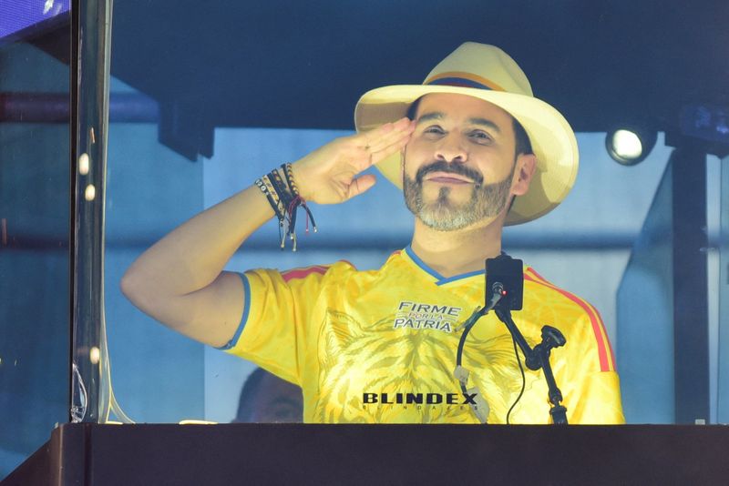 Colombian right-wing presidential candidate Abelardo De La Espriella gestures as he addresses supporters from a bulletproof booth during his campaign's closing event ahead of the June 21 runoff election against leftist candidate Ivan Cepeda, in Buga, Colombia, June 14, 2026. REUTERS/Cesar Quiroz