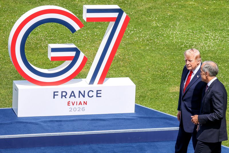 U.S. President Donald Trump and Canada's Prime Minister Mark Carney during a family photo at the G7 summit in Evian, France, on Tuesday June 16, 2026.   DOMINIQUE JACOVIDES/Pool via REUTERS