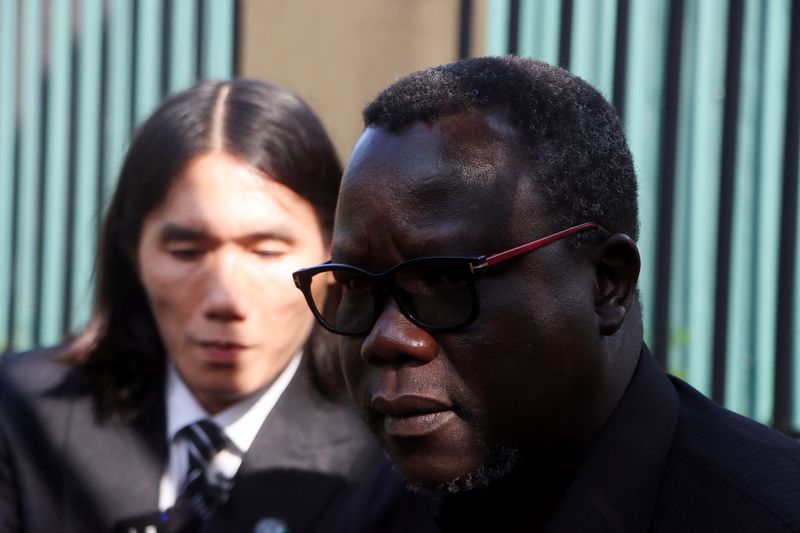 Ambassador Agok Anyar, spokesperson for South Sudan's Ministry of Foreign Affairs and International Cooperation, attends a press conference with Vietnamese deportee Thanh Tuan Phan as Thanh departs Juba after nearly a year in the country, at Juba International Airport, South Sudan, June 19, 2026. REUTERS/Samir Bol