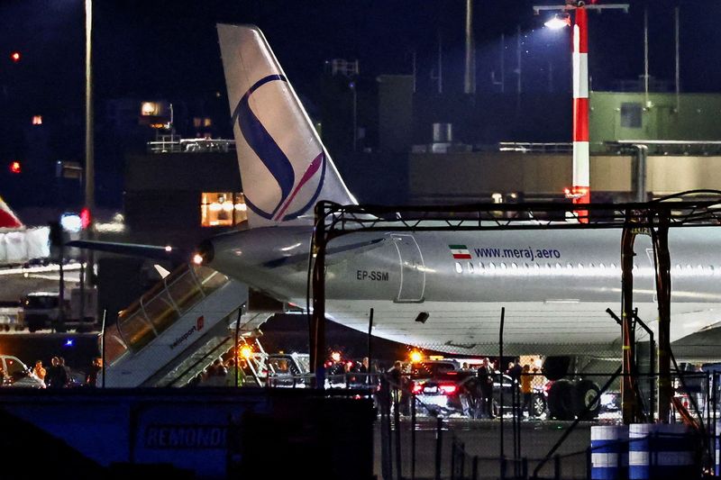 A convoy next to a plane after it landed, carrying an Iranian delegation led by chief negotiator Mohammad Baqer Qalibaf and Foreign Minister Abbas Araqchi, at the Zurich International Airport in Zurich, Switzerland, June 20, 2026. REUTERS/Denis Balibouse