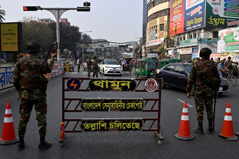 Members of the Bangladesh Army direct traffic at a temporary checkpoint in Dhaka, Bangladesh, February 11, 2026. REUTERS/Fatima Tuj Johora