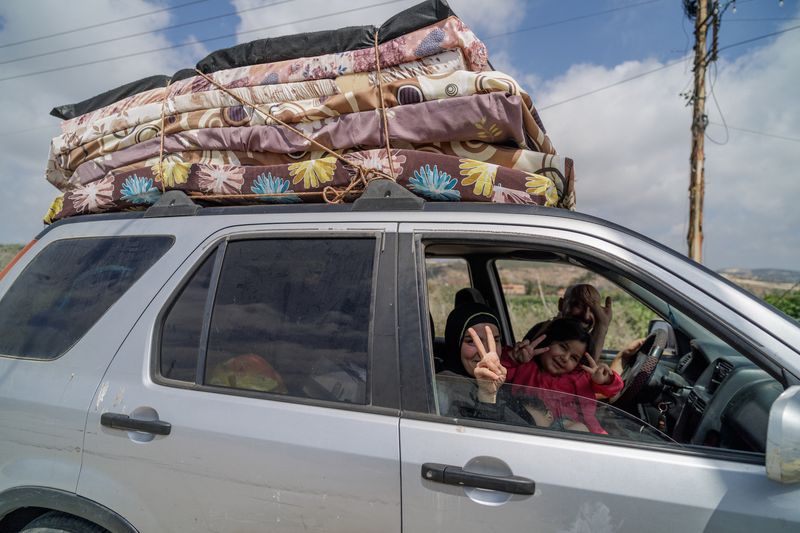 Displaced people react, as they make their way back to their home in southern Lebanon following an interim deal between the U.S. and Iran, in Qasmiyeh, Tyre district, Lebanon, June 21, 2026. REUTERS/Zohra Bensemra