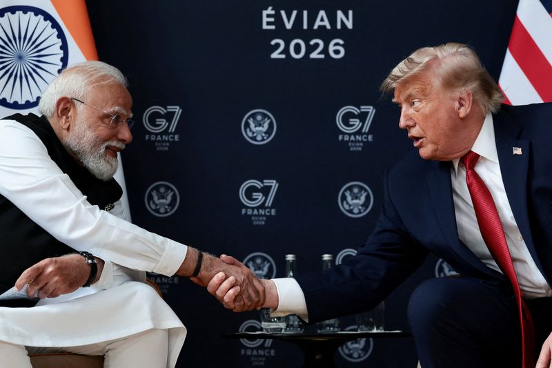 FILE PHOTO: U.S. President Donald Trump shakes hands with Indian Prime Minister Narendra Modi as they attend a bilateral meeting during the G7 Summit in Evian-les-Bains, France, June 17, 2026. REUTERS/Evelyn Hockstein/File Photo
