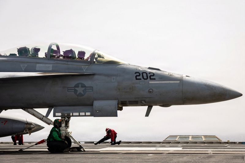 U.S. sailors prepare to launch an F/A-18F Super Hornet aircraft, attached to Strike Fighter Squadron 213, on the flight deck of the USS Gerald R. Ford for a mission supporting Operation Epic Fury during the Iran war at an undisclosed location, March 19, 2026.  U.S. Navy/Handout via REUTERS