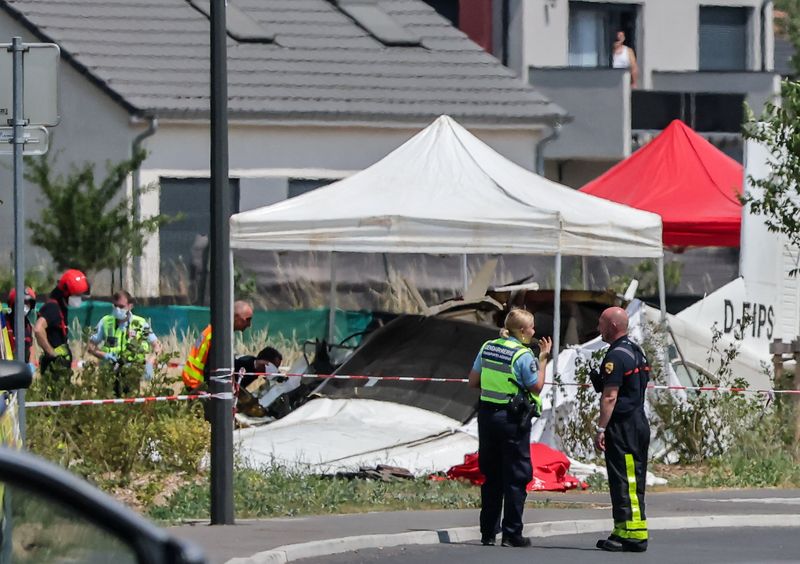 Rescuers work at the site of a plane crash in Tomblaine, France, June 28, 2026. REUTERS/Christian Hartmann