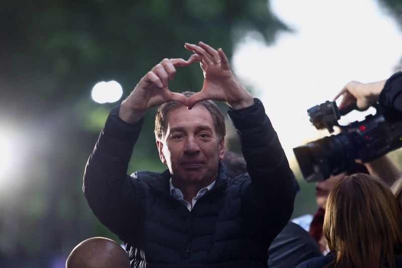 FILE PHOTO: Lawmaker Diego Santilli gestures during a La Libertad Avanza party rally in Tres de Febrero, on the outskirts of Buenos Aires, Argentina, October 17, 2025. REUTERS/Matias Baglietto/File Photo