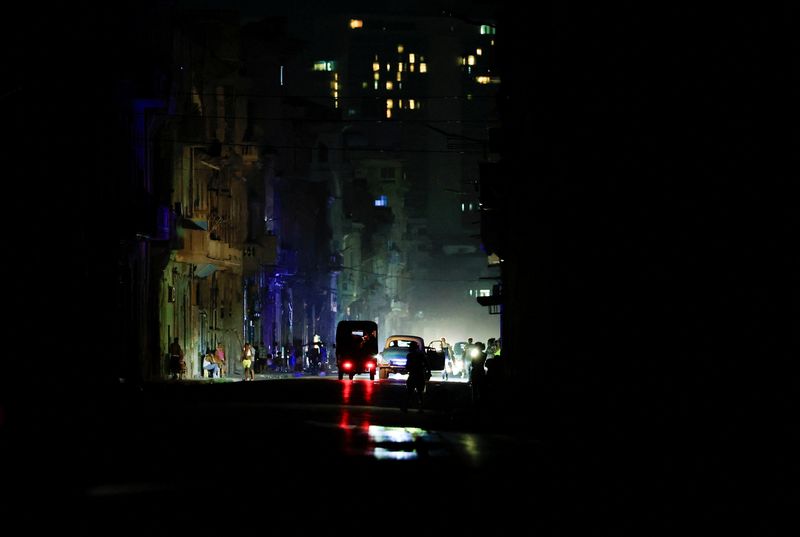 Vehicles drive down a dark street as Cuba's national electric grid collapsed at midday, leaving around 10 million people without power, in Havana, Cuba, July 6, 2026. REUTERS/Norlys Perez