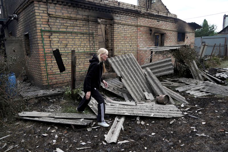 Resident Kateryna walks in front of her house that was heavily damaged during Monday’s Russian missile and drone strikes, amid Russia's attack on Ukraine, in Vyshneve, outside Kyiv, Ukraine July 7, 2026. REUTERS/Vladyslav Smilianets