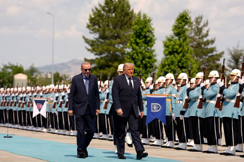 U.S. President Donald Trump walks with Turkish President Recep Tayyip Erdogan during a formal arrival at the Bestepe Presidential Compound at the NATO summit in Ankara, Turkey, Tuesday, July 7, 2026.     Emrah Gurel/Pool via REUTERS