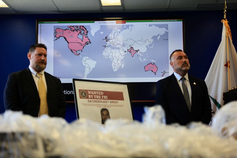 A screen displays a map, as U.S. and Canadian law enforcement officials announce federal charges and arrests of alleged members of a transnational organized crime group, at FBI offices in Los Angeles, California, U.S. July 7, 2026.  REUTERS/David Swanson