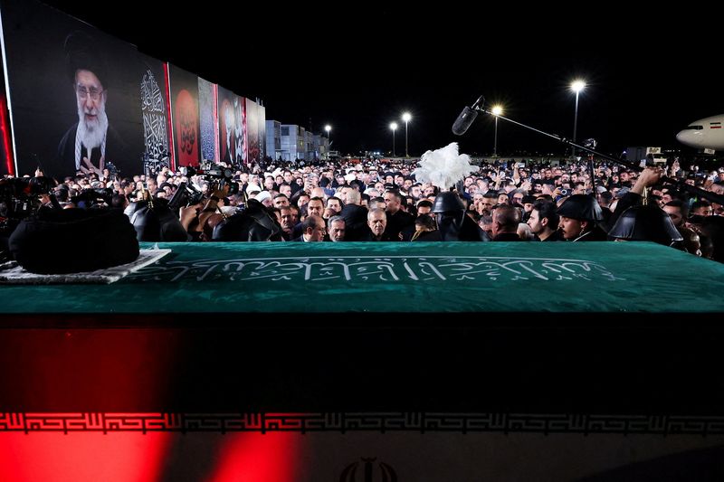 Mourners gather around the casket of Iran’s late Supreme Leader Ayatollah Ali Khamenei, who was killed on February 28 during Israeli and U.S. airstrikes on Iran, after its arrival at Najaf International Airport in Najaf, Iraq, July 7, 2026. Iran's Presidential website/HANDOUT via REUTERS