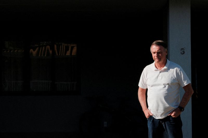 Brazil’s former President Jair Bolsonaro looks on from his home as Sao Paulo’s Governor Tarcisio de Freitas (not pictured) leaves after a visit in Brasilia, Brazil September 29, 2025. REUTERS/Diego Herculano