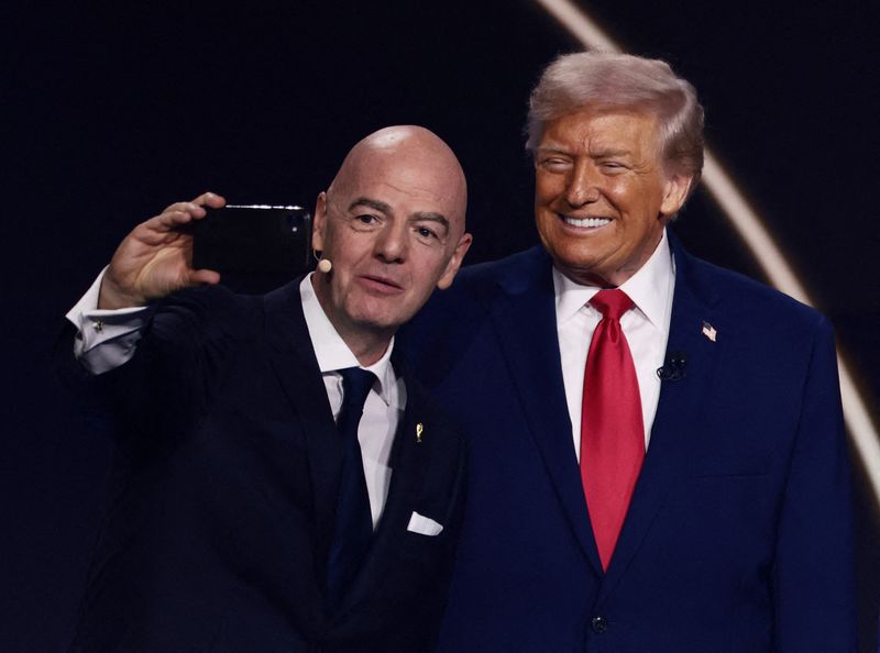 FILE PHOTO: FIFA President Gianni Infantino and U.S. President Donald Trump pose for a selfie during the FIFA World Cup 2026 Draw at the John F. Kennedy Center for the Performing Arts, Washington, D.C., U.S., December 5, 2025. REUTERS/Evelyn Hockstein/File Photo