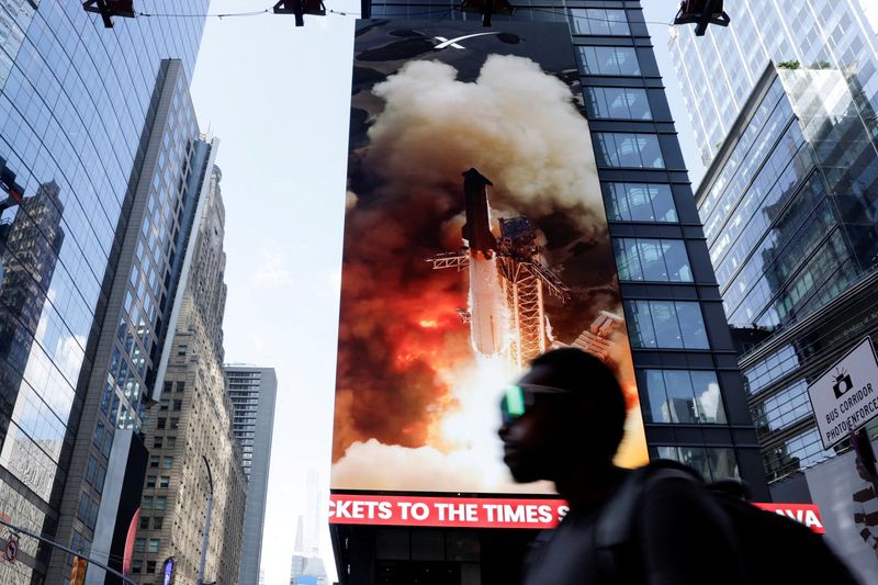 FILE PHOTO: A sign displays outside Nasdaq on the day of SpaceX's initial public offering (IPO) in New York City, U.S., June 12, 2026. REUTERS/Jeenah Moon/File Photo