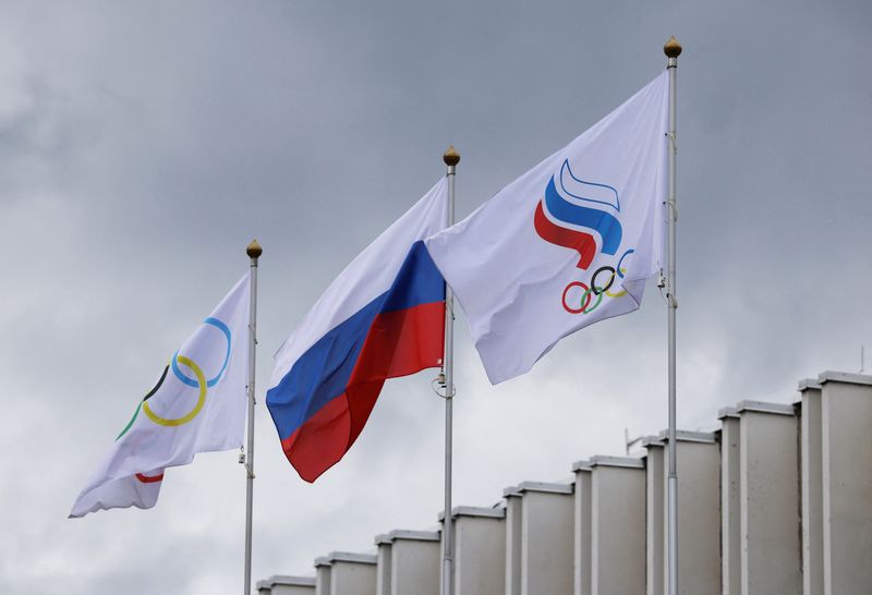 The Russian flag, the Olympic flag and the flag of the Russian Olympic Committee fly at the Committee's headquarters in Moscow, Russia July 8, 2026. REUTERS/Ramil Sitdikov
