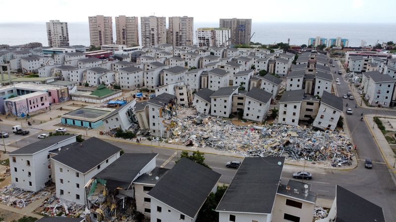 A drone view shows damaged buildings in the aftermath of the June 24 earthquakes, at the Hugo Chavez housing complex, built under the Venezuelan government's 'Gran Mision Vivienda' initiative, in Catia la Mar, La Guaira state, Venezuela July 13, 2026. REUTERS/Leonardo Fernandez Viloria