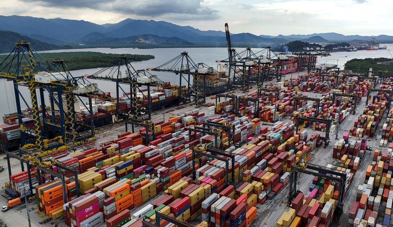 A drone view shows ships and containers at the Port of Santos, in Santos, Brazil, April 3, 2025. REUTERS/Amanda Perobelli