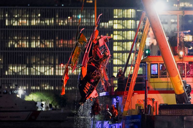 Emergency personnel work at the scene of a helicopter crash on the Hudson River near lower Manhattan in New York, as seen from Newport, New Jersey U.S., April 10, 2025.  REUTERS/Eduardo Munoz