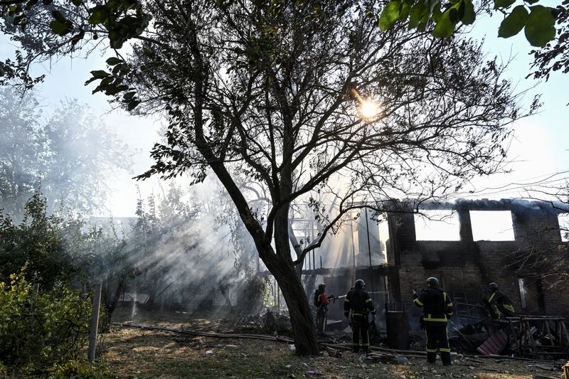 Firefighters work at the site of residential houses hit by a Russian air strike, amid Russia's attack on Ukraine, in Zaporizhzhia, Ukraine July 16, 2026. REUTERS/Stringer