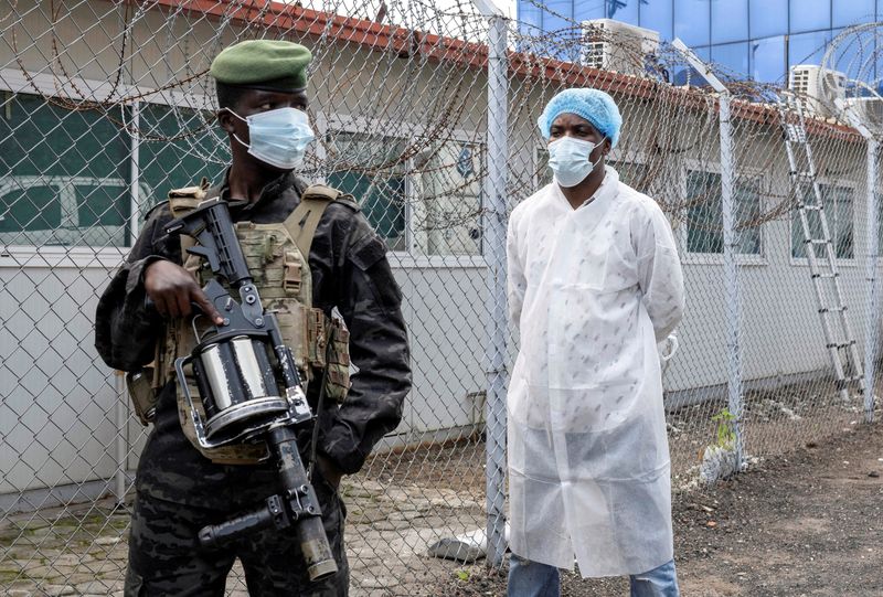 A member of the M23 rebel group stands guard as provincial authorities visit the Rodolphe Merieux Laboratory, National Biomedical Research Institute (INRB), where samples from suspected Ebola cases are tested, as part of the response to the epidemic in Goma, North Kivu province of the Democratic Republic of Congo, May 19, 2026. REUTERS/Arlette Bashizi/File Photo