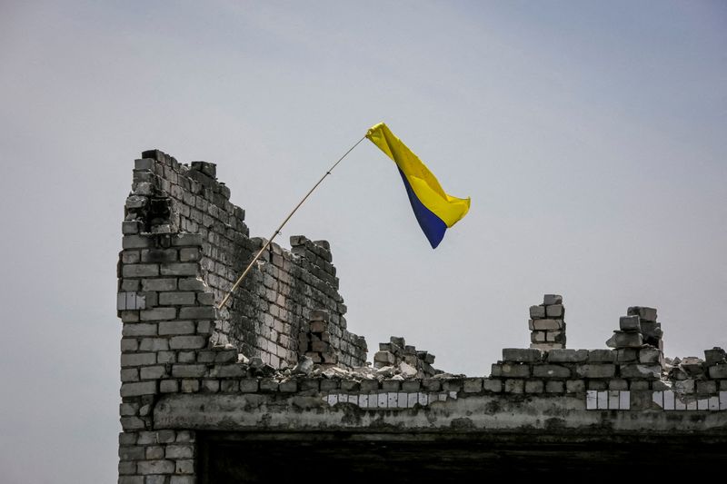 A Ukrainian national flag is seen, amid Russia's attack on Ukraine, near the front line in the newly liberated village Neskuchne in Donetsk region, Ukraine June 13, 2023. REUTERS/Oleksandr Ratushniak