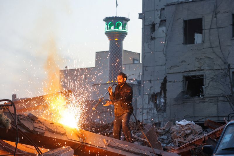 َA man works amid debris, following an Israeli and U.S. strike on a police station, amid the U.S.-Israel conflict with Iran, in Tehran, Iran, March 2, 2026. Majid Asgaripour/WANA (West Asia News Agency) via REUTERS