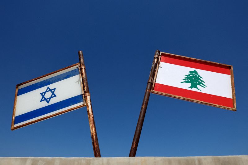 FILE PHOTO: Representations of the Israeli and Lebanese flags at a memorial near the Israel-Lebanon border, outside Metula, Israel, June 27, 2026, after Israel and Lebanon signed a framework agreement following U.S.-mediated talks. REUTERS/Amir Cohen/File Photo