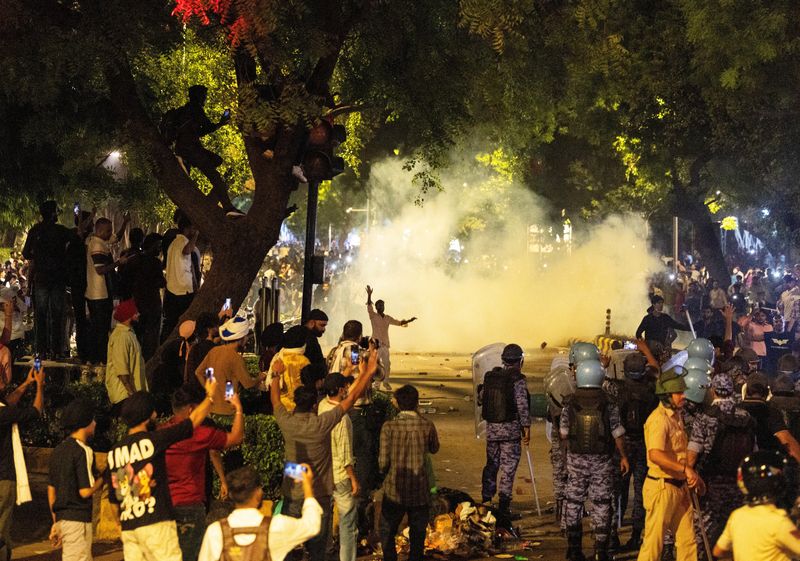 Police use teargas to control the crowd during the ongoing protest of Cockroach Janata Party (CJP), two days after thousands of protesters marched towards parliament demanding the resignation of Education Minister Dharmendra Pradhan over examination paper leaks, at Jantar Mantar in New Delhi, India, July 22, 2026. REUTERS/Adnan Abidi